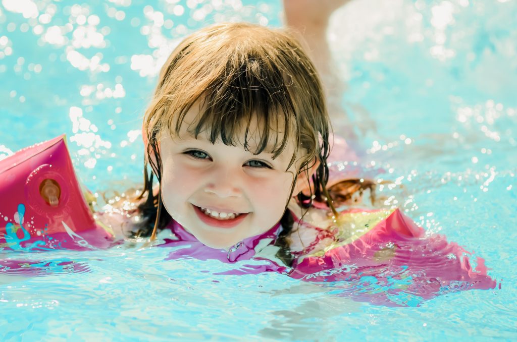 A girl enjoys the pool at a Sydney family reunion.