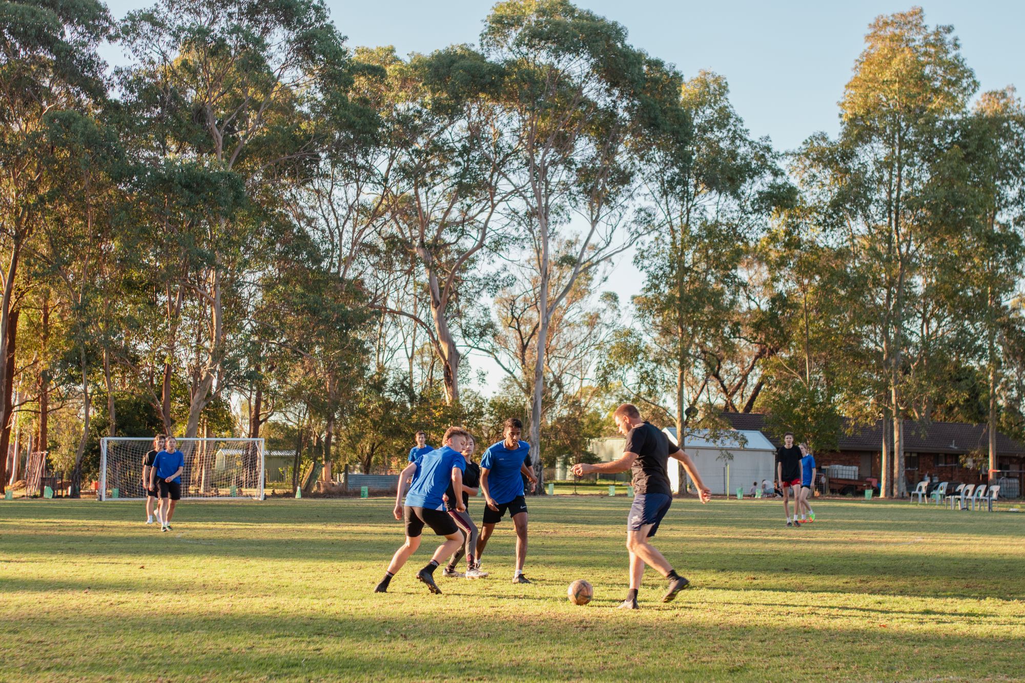Students and teachers play soccer at their school camp in Sydney